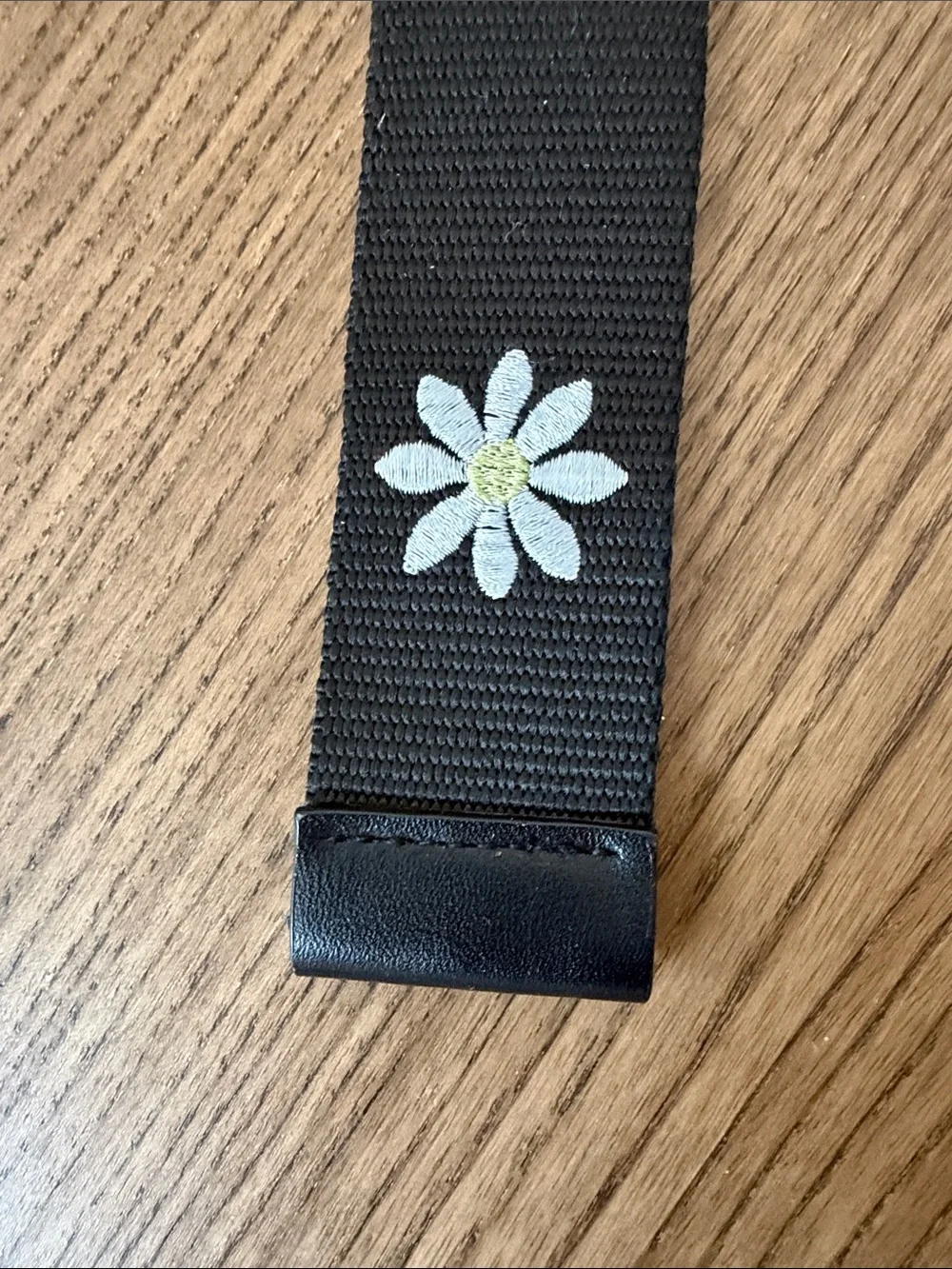 Black Webbed Belt with White Daisy Embroidered Design and Silver Ring Closure